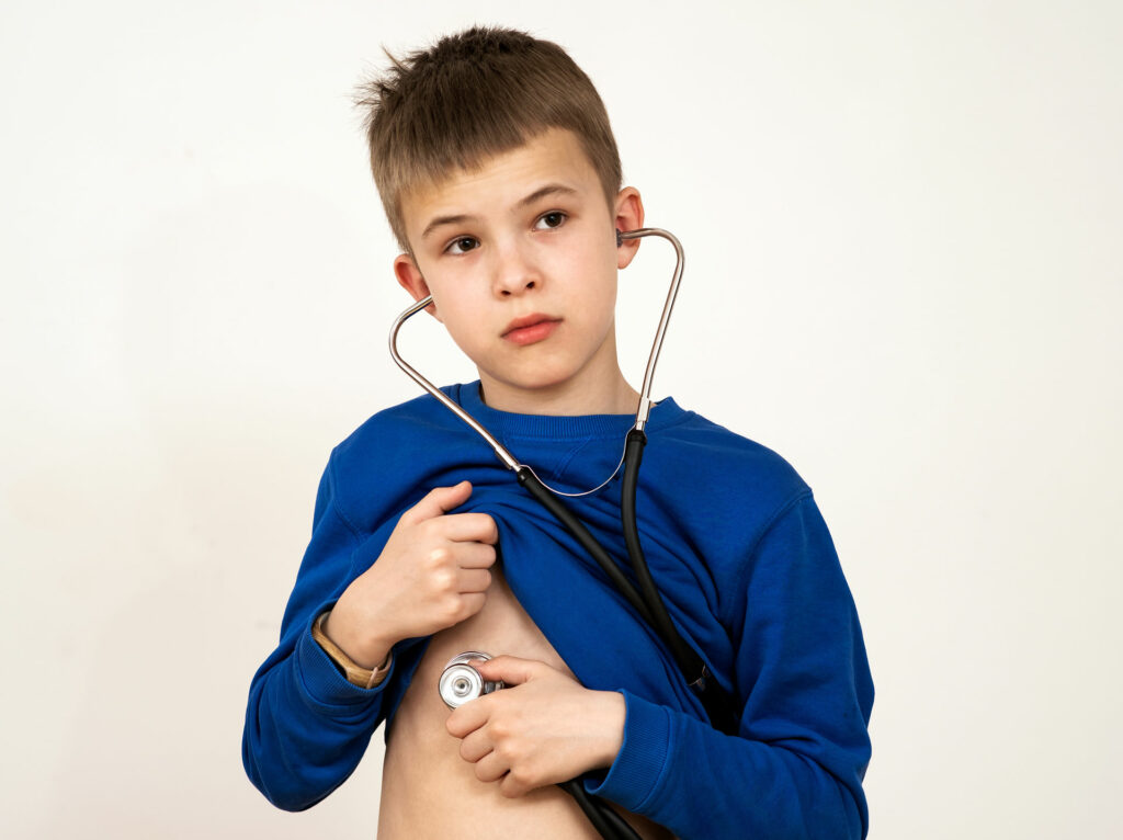 child boy playing doctor with stethoscope in hands 2022 10 11 02 51 11 utc