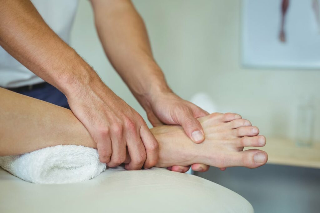 physiotherapist giving leg massage to a woman 2021 08 28 17 56 09 utc@1x